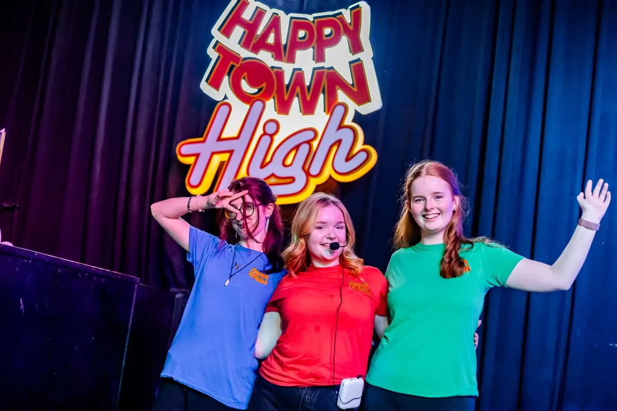 The Happy Town High team on stage
