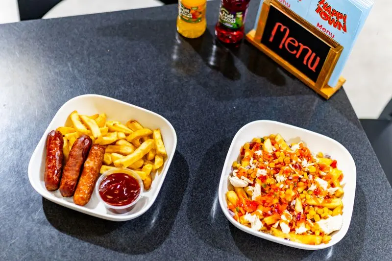 A kids’ meal of sausages and chips with a portion of loaded fries