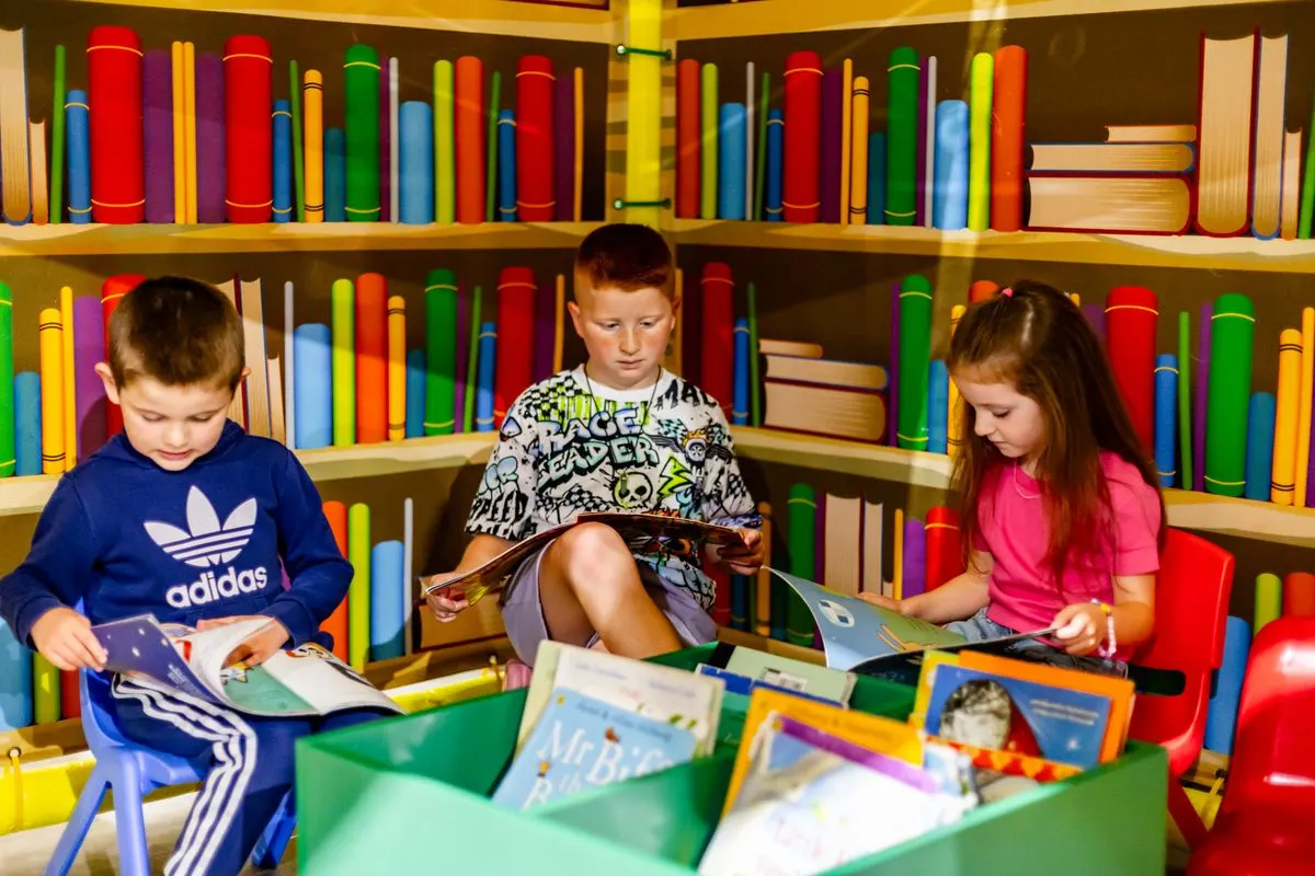 Children reading together in the Happy Town library